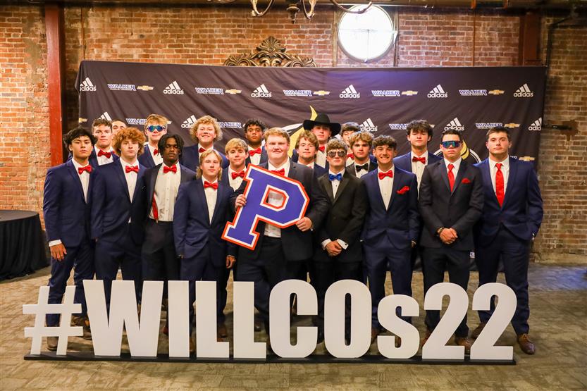 Page High team gathers aruond WILLCOs sign